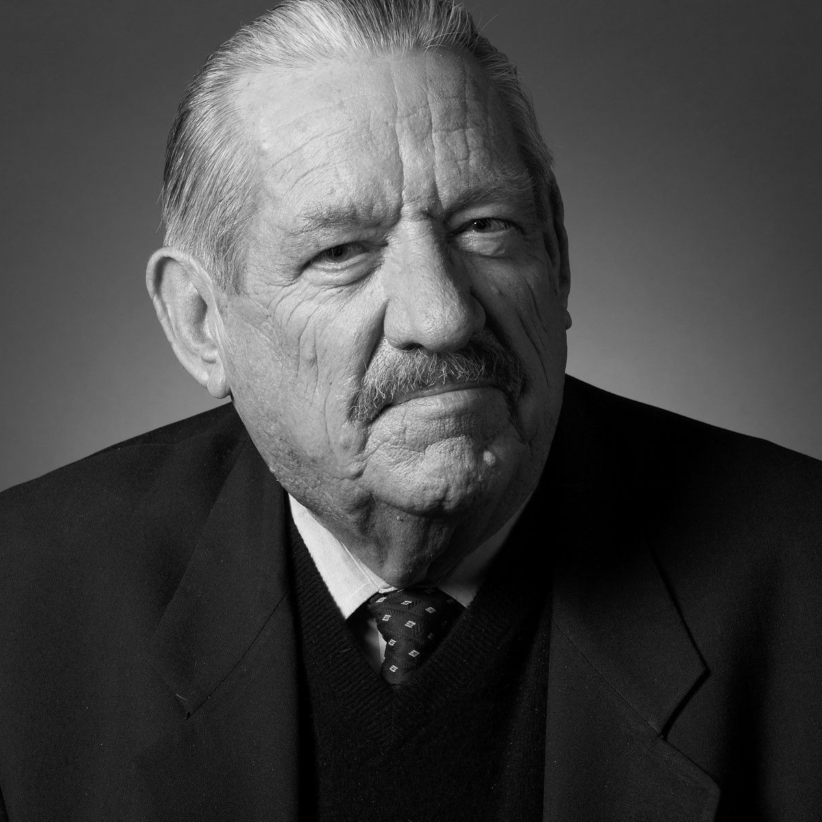 B&W image of senator Fred Harris an older white gentleman in a black suit and tie